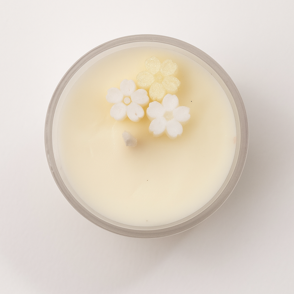 Candle with floral design on a white background